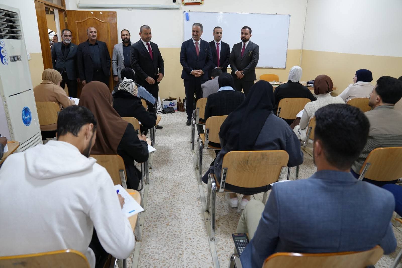 The university president is monitoring the examination process in the colleges.